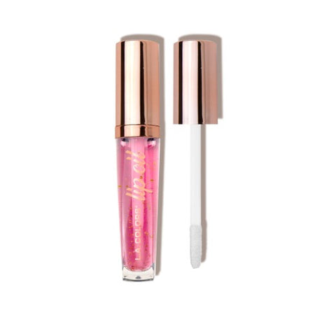 Nourishing lip oil with Sweetie Candy scent, featuring gold flakes for shine and ultra-hydrating properties for soft lips.