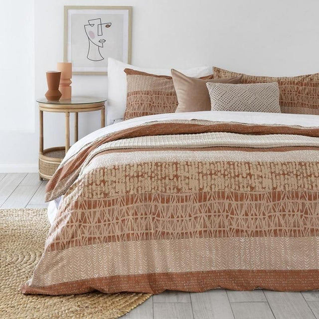 King Single duvet cover in terracotta with geometric patterns, ideal for modern bedding and hospitality use.