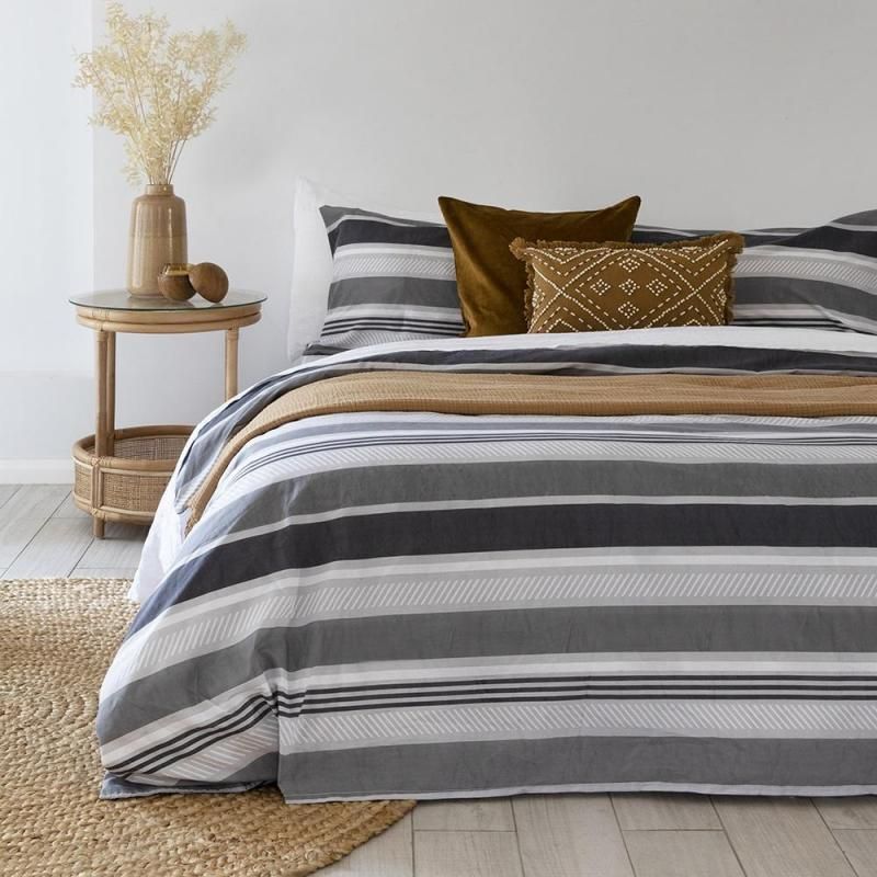 Double duvet cover set in grey with horizontal stripes, made from soft polyester-cotton blend, includes 2 matching pillowcases.