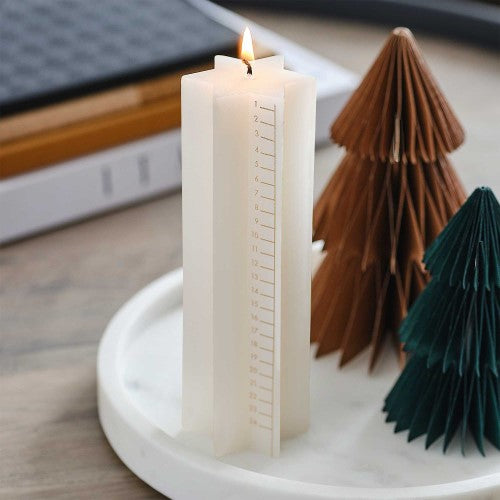 Cosy copper star-shaped advent calendar candle, 18cm x 6cm, perfect for festive decor and daily holiday countdowns.