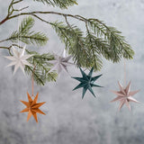 Copper-hued paper star decorations, 9cm, pack of 5, eco-friendly and perfect for festive decor on trees or home.