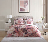 Queen Duvet Cover Set in blush tones with floral design, crafted from 100% cotton sateen, includes duvet and two pillowcases.