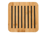 Classic round charcoal bamboo trivet with raised silicone design, perfect for protecting surfaces from hot cookware.