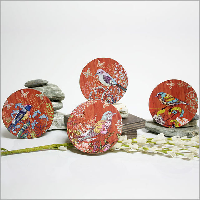 Set of 4 vibrant bird coasters on MDF with cork base, ideal for protecting surfaces and enhancing home decor.