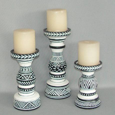 Aztec-patterned candle holder measuring 16cm, perfect for enhancing decor and holding standard tapered candles.