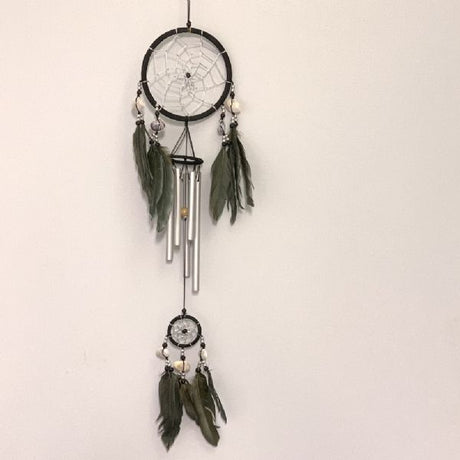 Black dreamcatcher wind chime with shells and feathers, measuring 12 cm, adds serene sound and artistry to any space.