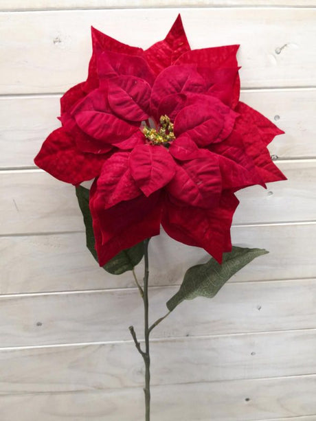 XLarge artificial red poinsettia with lush leaves, perfect for holiday decor and allergen-free, enhancing festive spaces.