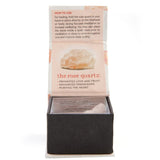 Raw uncut rose quartz stone in a gift box, promoting love and peace, measuring approximately 5 cm wide.