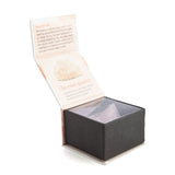 Raw uncut rose quartz stone in a gift box, promoting love and calm with unique energy and aesthetic appeal.