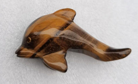 5cm Tiger Eye Dolphin figurine featuring golden and brown stripes, symbolizing strength, protection, and positive energy.