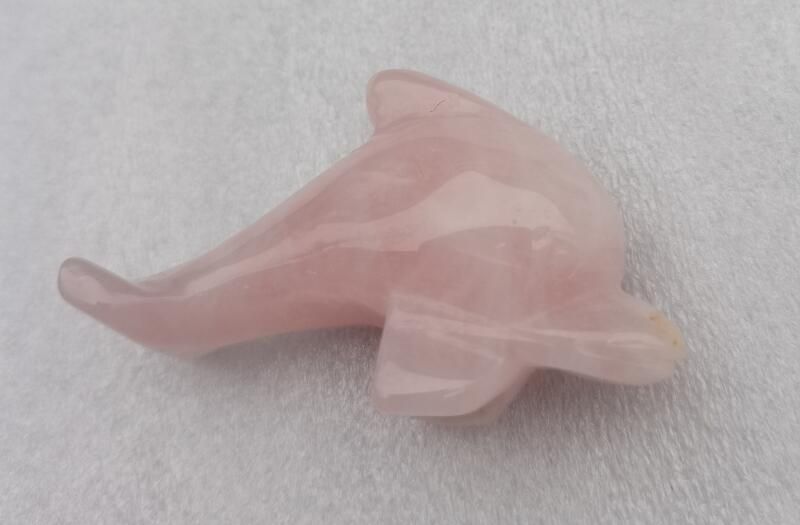 Delicate 5cm Dolphin figurine made from rose quartz, symbolizing love and harmony, perfect for home decor and gifts.