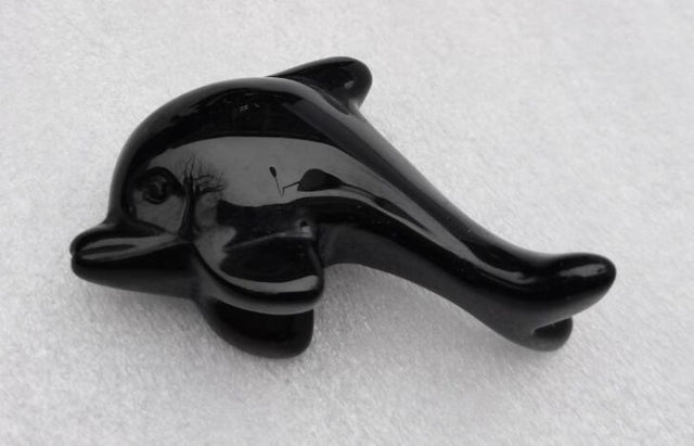 Dolphin-shaped black obsidian gemstone (5cm) for protection, emotional healing, and home decor.