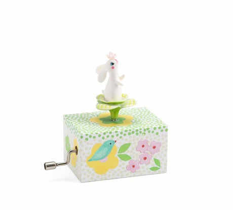 Musical box featuring a twirling bunny in a garden, playing ‘Danny Boy’ for enchanting bedtime moments.