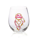 Hand-blown stemless wine glass with whimsical dreamcatcher design and angled rim for optimal aeration.