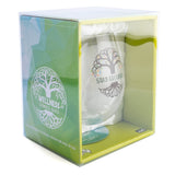 Hand-blown stemless glass with Celtic tree of life design and vibrant leaves, featuring the phrase 'stay grounded'.