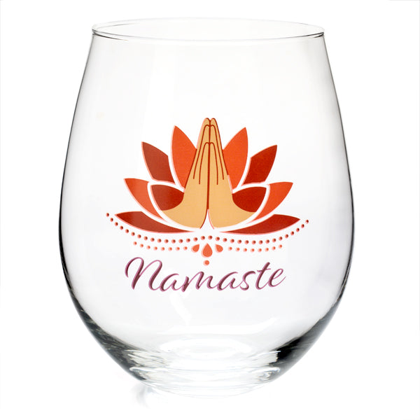 Hand-blown stemless glass with lotus design and 'namaste' text, promoting mindfulness and serenity in your beverage experience.