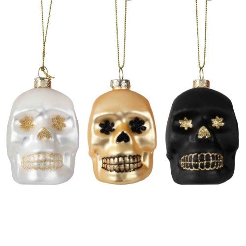 Skull-shaped tree decorations in black, white, and gold, perfect for Halloween or unique year-round decor.