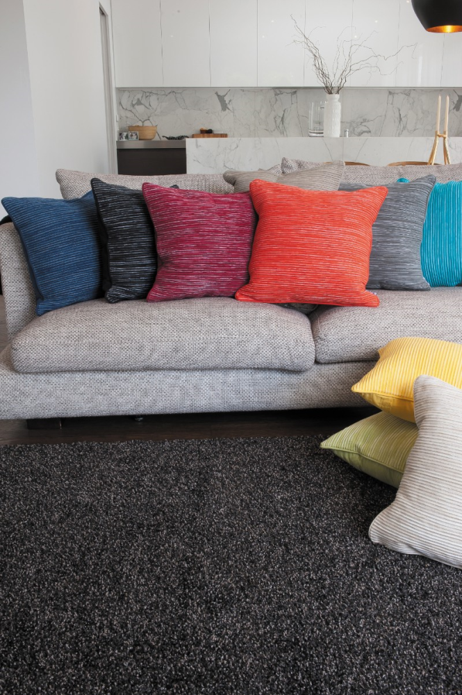 Bright yellow Rakaia cushion (45x45cm) by Limon, made from 100% cotton, adding comfort and style to any space.