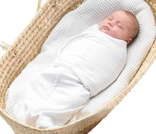 Dreamswaddle in Green Criss-Cross, a secure 100% cotton swaddle for babies 7-14lbs, featuring a double wrap system and easy diaper access.