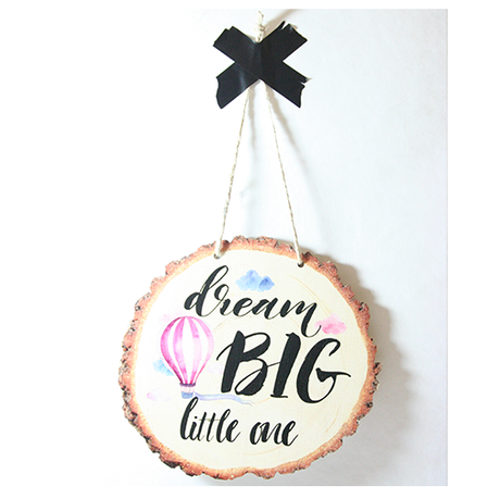 Wood slice wall art featuring "Dream Big" message, crafted from eco-friendly pine veneer, perfect for inspiring decor.