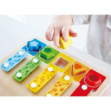 Colorful Hape Shape Sorter Xylophone toy for toddlers combines music, shape sorting, and piano play for early development.