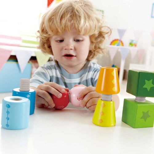 Colorful Hape Twist And Turnables Blocks featuring screw-together shapes for creative building and fine motor skill development.