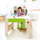 Kid-sized wooden art table and stool set for creative play, featuring a storage seat for art supplies.