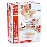 Wooden Hape Cook & Serve Set for kids, featuring pot, frying pan, utensils, and plates, designed for imaginative culinary play.