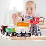 Colorful Hape Cargo Delivery Loop train set with magnetic crane for loading containers on an oval track, designed for ages 3+.