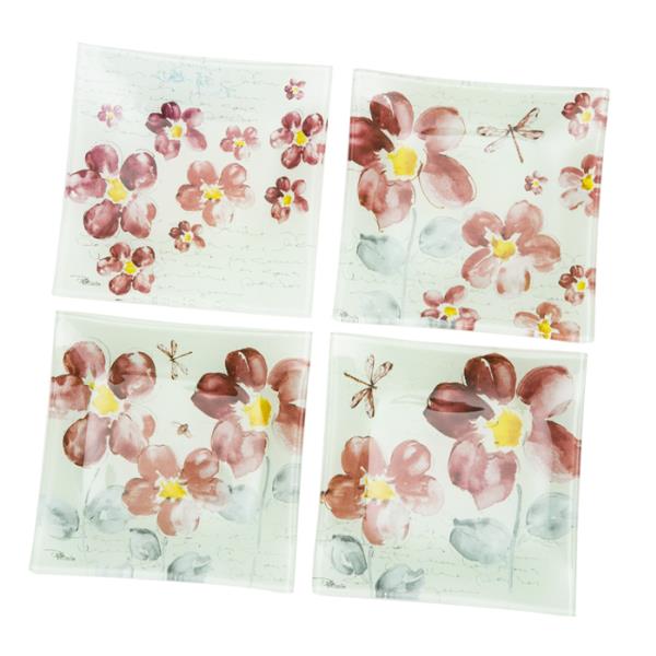 Set of four 15 cm glass plates with a floral design, perfect for serving snacks or organizing small items.