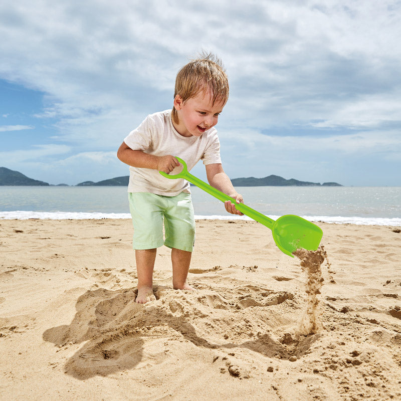 Bright green Hape Mighty Shovel designed for toddlers, perfect for outdoor play, exploration, and imaginative gardening adventures.