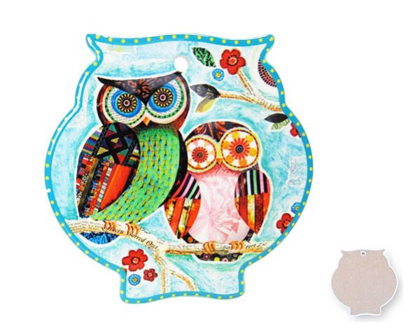 Charming owl-shaped trivets in ceramic with cork backing, ideal for protecting surfaces and adding whimsical kitchen decor.