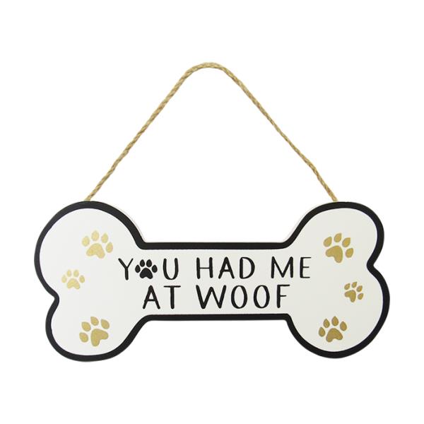 Dog bone-shaped wall art with twine hanger, featuring paw prints and "You had me at woof" for dog lovers.