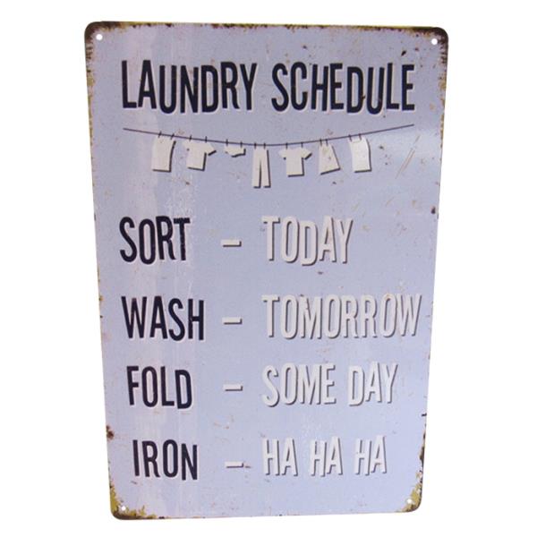"Vintage-inspired tin wall art featuring a quirky laundry roster, perfect for enhancing home decor."