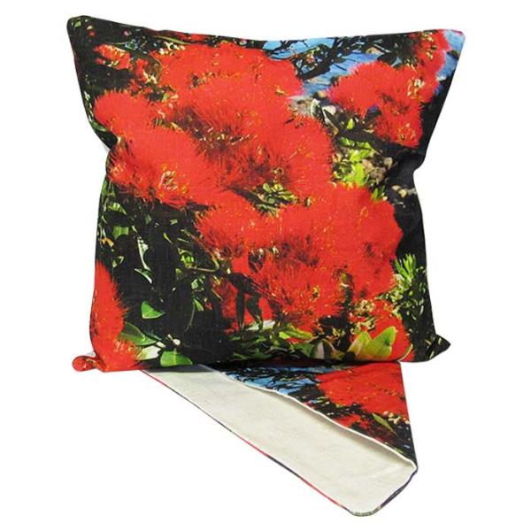 Vibrant Pohutakawa floral cushion cover, made from durable fabric, perfect for enhancing home decor with New Zealand elegance.