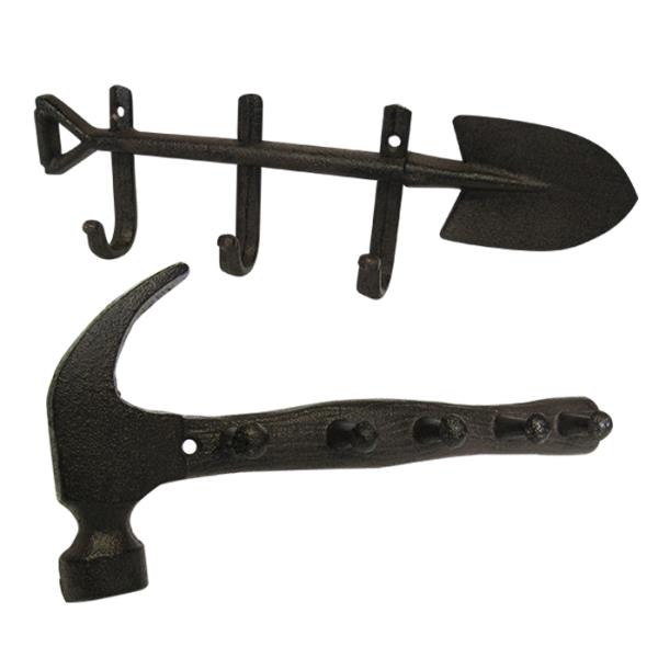 Set of 2 rustic cast iron hooks shaped like a garden spade and hammer, perfect for stylish home organization.