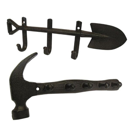 Set of 2 rustic cast iron hooks shaped like a garden spade and hammer, perfect for stylish home organization.
