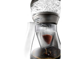 DeLonghi Clessidra Drip Coffee Machine brewing rich, aromatic coffee with automatic showerhead control and spacious carafe.