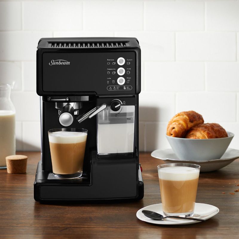 Black Sunbeam Café Barista coffee machine with 15 bar pump, milk reservoir, and one-touch control for barista-quality drinks at home.