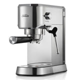 Compact stainless steel espresso machine with steam wand for microfoam, preset controls for cafe-style coffee at home.