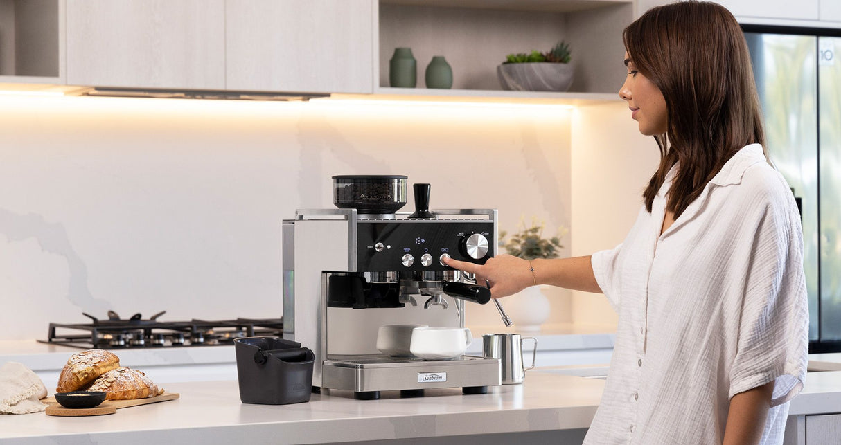 Sunbeam Origins Espresso Machine in silver and black, featuring a 58mm group head and integrated grinder for fresh coffee.