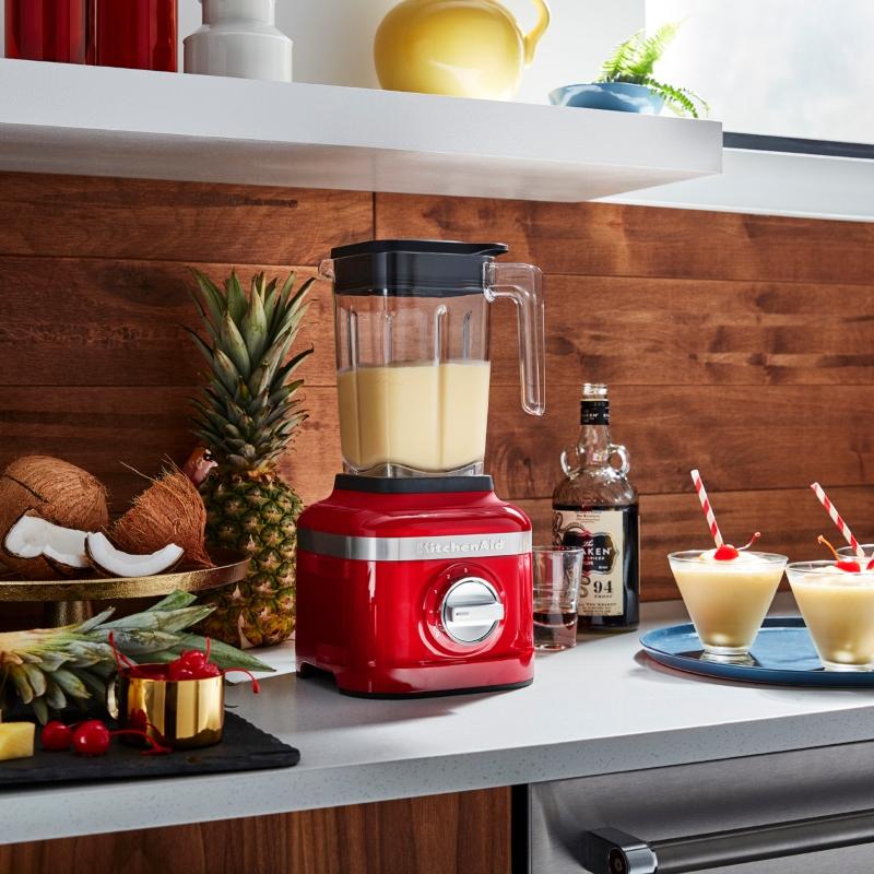 KitchenAid K150 Ice Crushing Blender in Empire Red with 3 speeds, 0.9 HP motor, and 1.4L BPA-free jar for smoothies and frozen drinks.