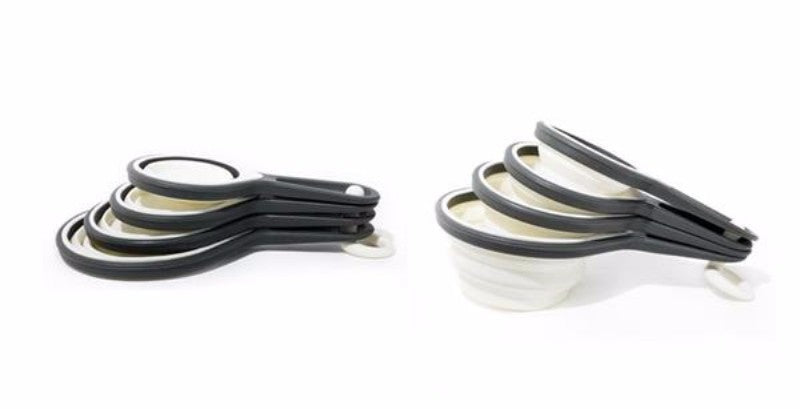 Grey silicone collapsible measuring cups set of 4; includes 1 cup, ¾ cup, ½ cup, and ¼ cup; dishwasher safe and eco-friendly.