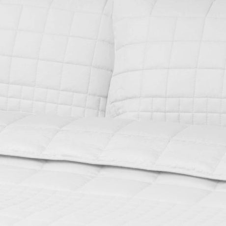 Elegant white quilted coverlet set for queen beds, includes 2 matching pillowcases, made from 100% cotton for year-round comfort.