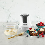 Mini Glass MultiChopper with a sleek white design, 750mL glass bowl, stainless steel blades, and one-button operation.