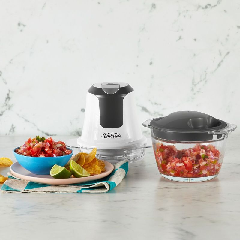 Mini Glass MultiChopper: sleek white food chopper with 750mL glass bowl, stainless steel blades, and easy one-button operation.