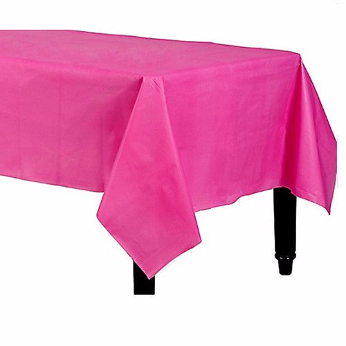 Bright pink rectangular plastic table cover, 137cm x 274cm, waterproof and easy to clean for parties and celebrations.