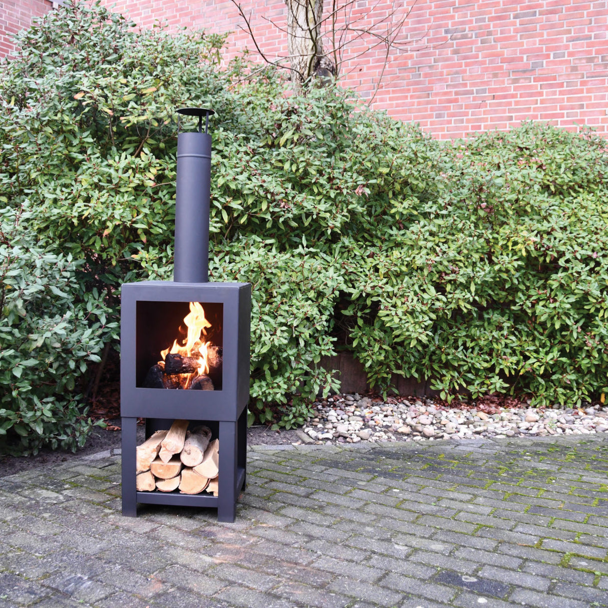 Stylish black terrace heater with wood storage, perfect for cozy outdoor gatherings, measuring 38 x 38 x 136 cm.