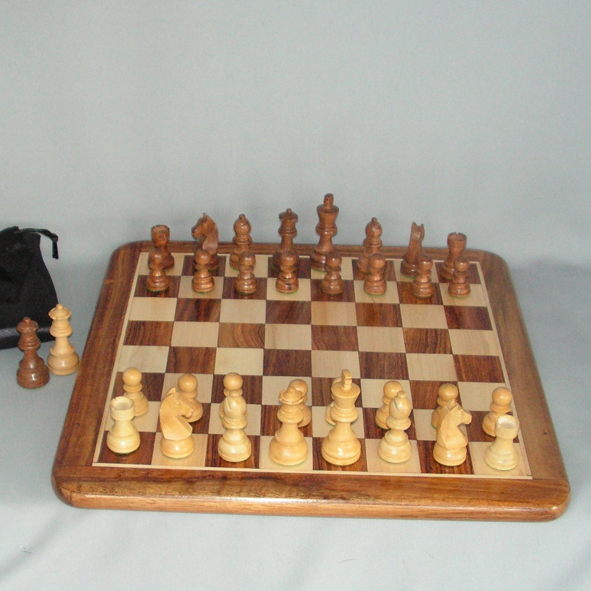 Hand-carved 16" chess set featuring a 75MM king, showcasing exquisite craftsmanship and elegant design for enthusiasts and collectors.