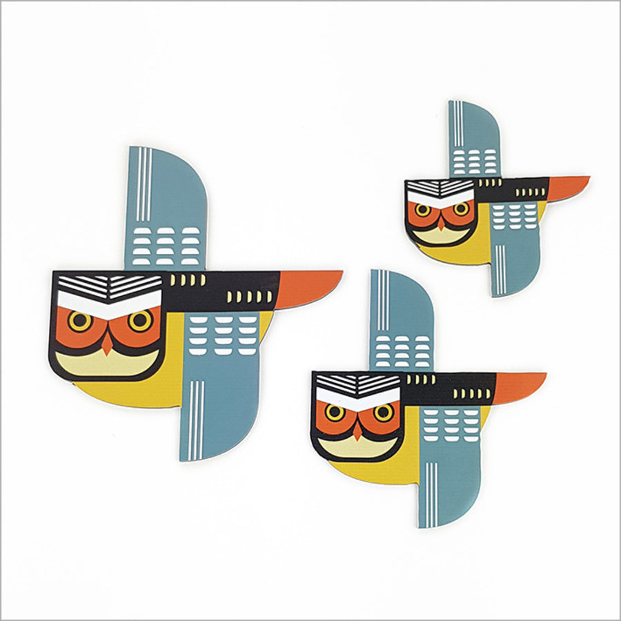 Set of 3 printed Ruru wall art pieces on brushed silver, showcasing vibrant Kiwiana designs for indoor or sheltered outdoor spaces.